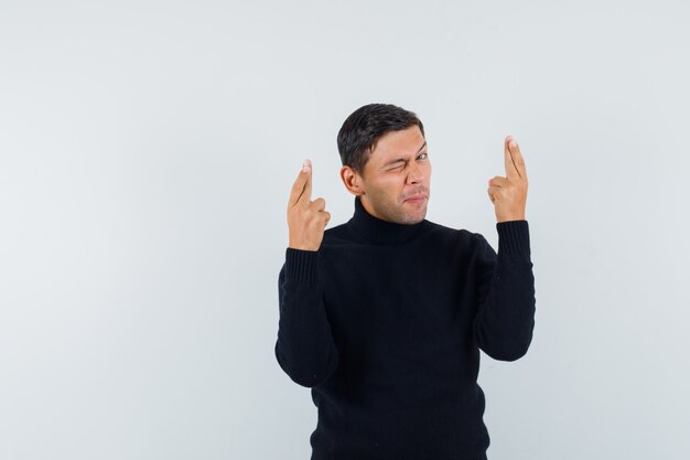 Free photo an expressive man is posing in the studio