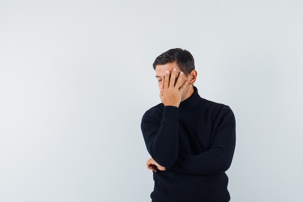 an expressive man is posing in the studio