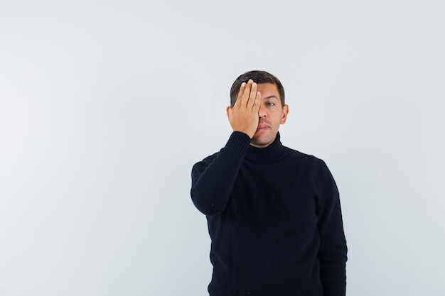 An expressive man is posing in the studio