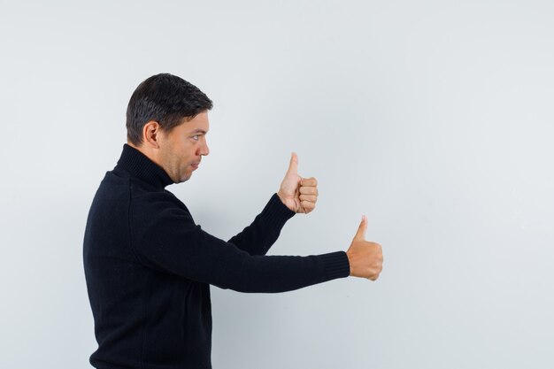 An expressive man is posing in the studio