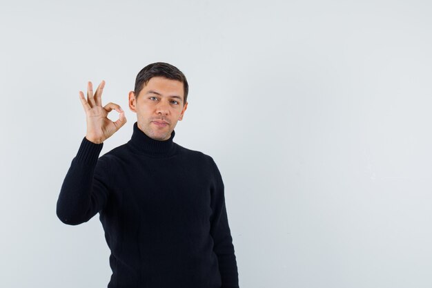 An expressive man is posing in the studio