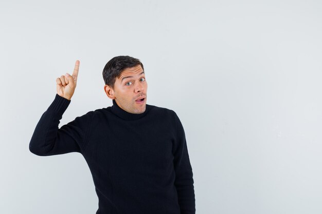 An expressive man is posing in the studio