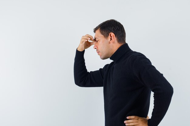 An expressive man is posing in the studio