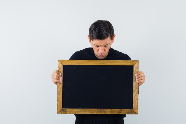 Free photo an expressive man is posing in the studio