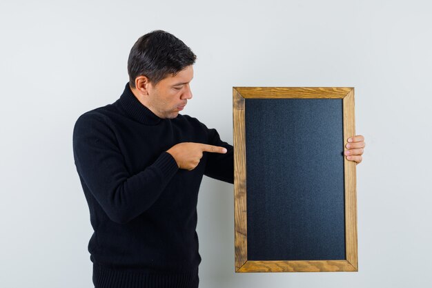 An expressive man is posing in the studio