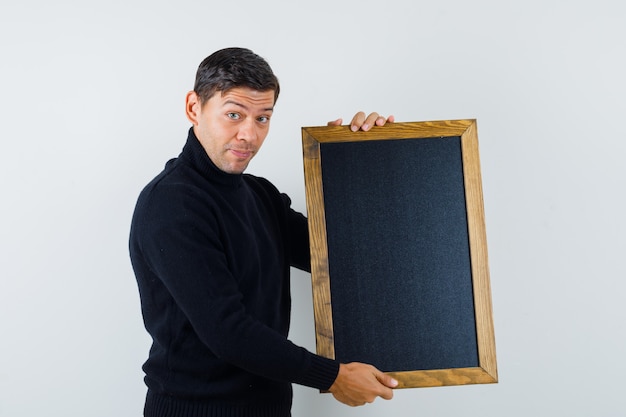 An expressive man is posing in the studio