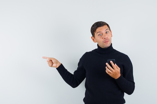 An expressive man is posing in the studio