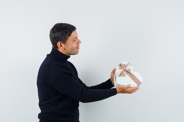 An expressive man is posing in the studio