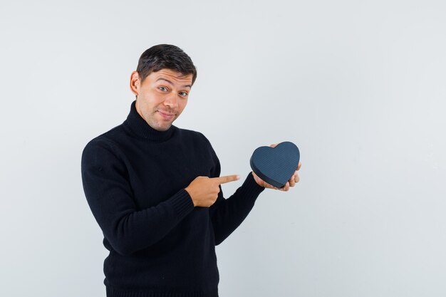 An expressive man is posing in the studio