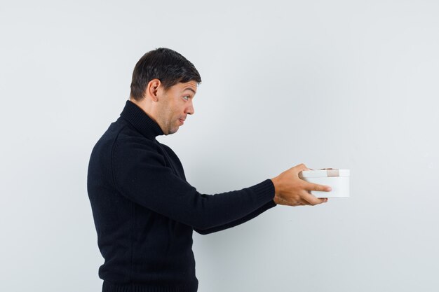 An expressive man is posing in the studio