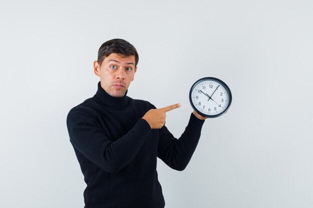 An expressive man is posing in the studio