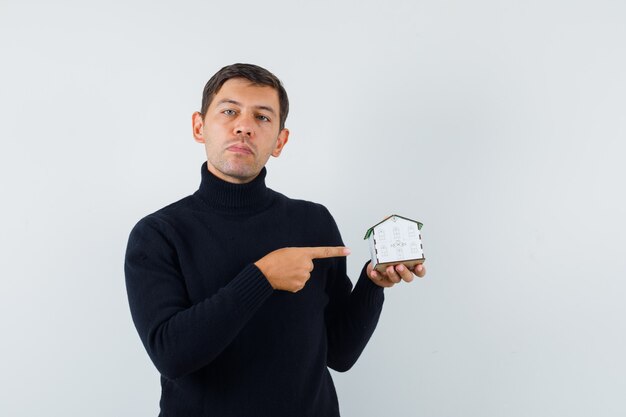 An expressive man is posing in the studio