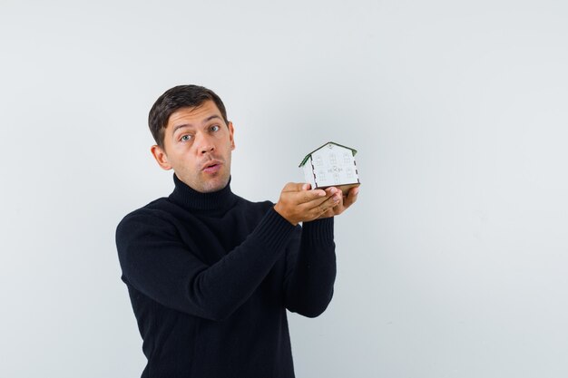 An expressive man is posing in the studio