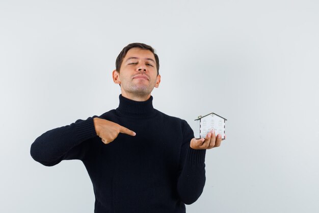 An expressive man is posing in the studio