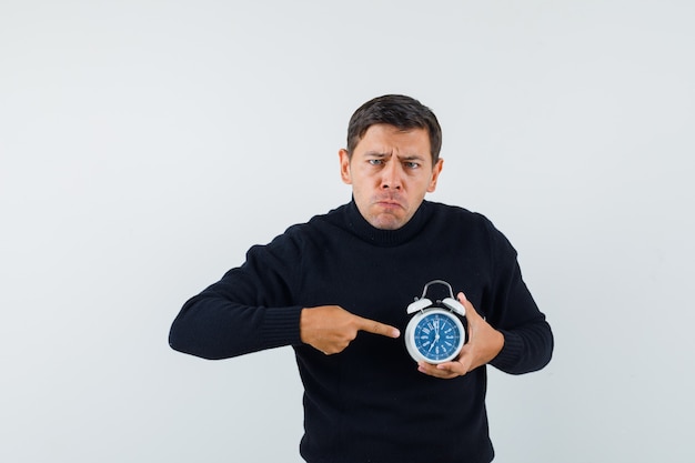 Free photo an expressive man is posing in the studio