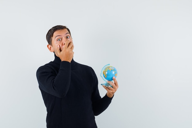 An expressive man is posing in the studio