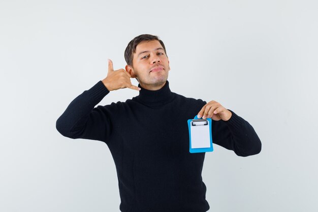 An expressive man is posing in the studio