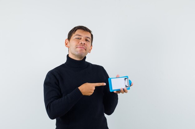 An expressive man is posing in the studio