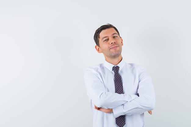 An expressive man is posing in the studio