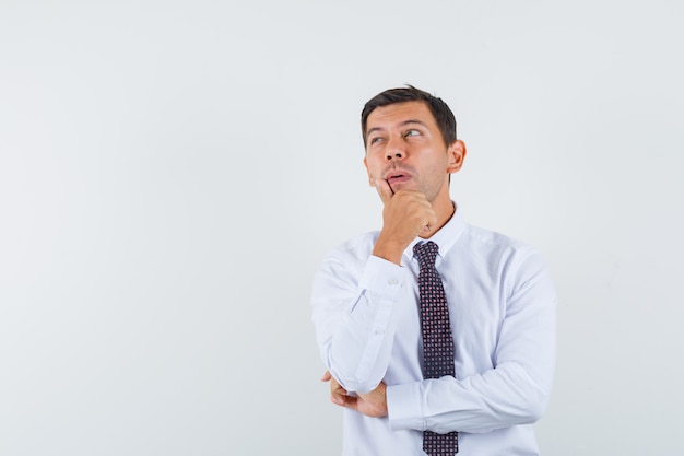 An expressive man is posing in the studio