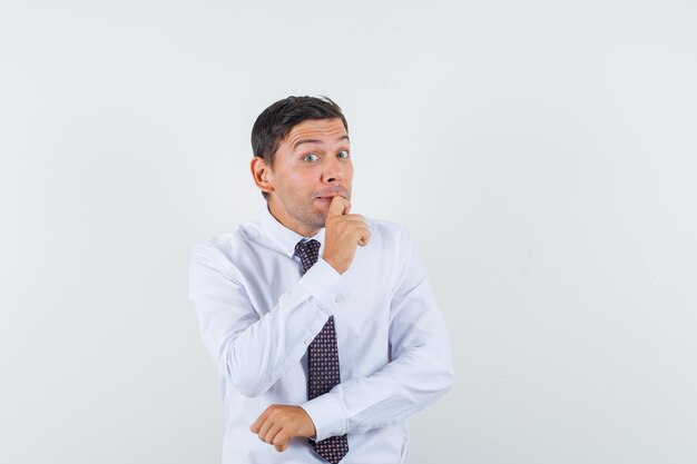 An expressive man is posing in the studio