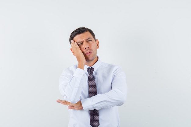 An expressive man is posing in the studio