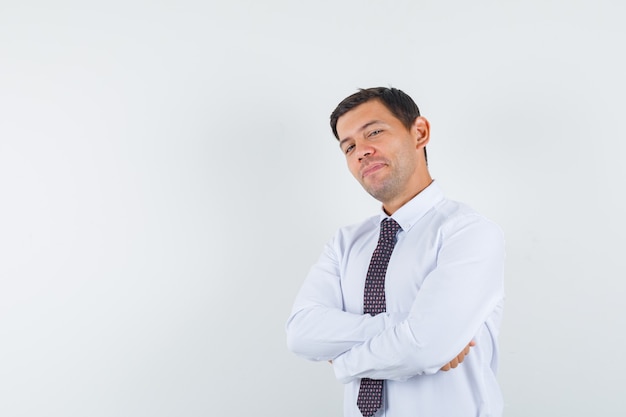 An expressive man is posing in the studio