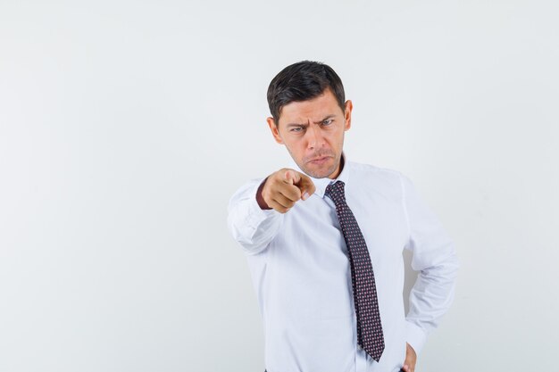 An expressive man is posing in the studio