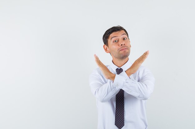 An expressive man is posing in the studio