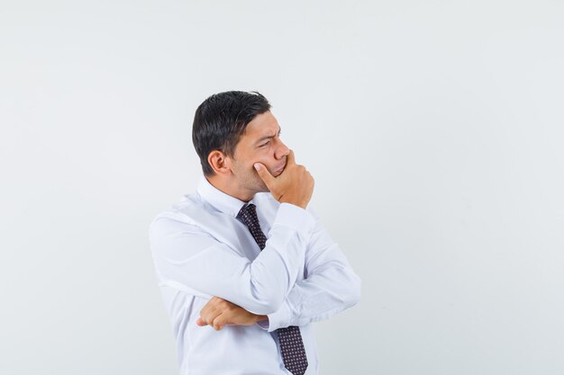 An expressive man is posing in the studio