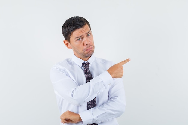 An expressive man is posing in the studio