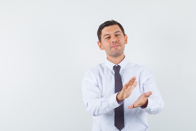 An expressive man is posing in the studio