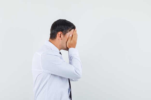 An expressive man is posing in the studio