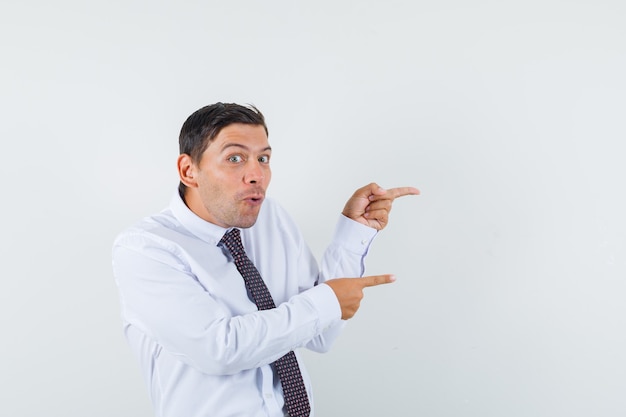 An expressive man is posing in the studio