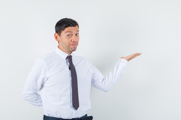 An expressive man is posing in the studio