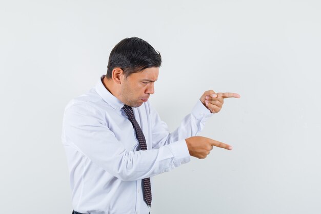 An expressive man is posing in the studio