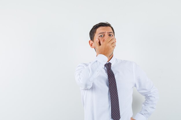 An expressive man is posing in the studio