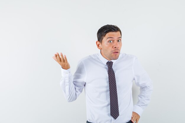 An expressive man is posing in the studio