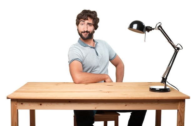 Expressive man sitting at his workplace