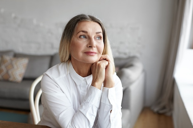 Expressive middle aged woman posing