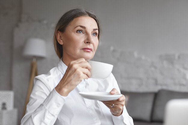 Expressive middle aged woman posing