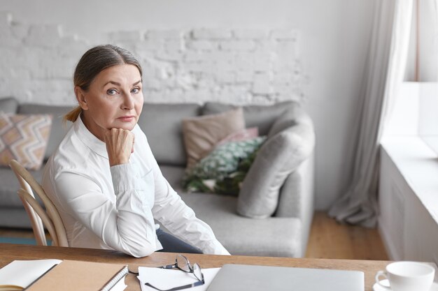 Expressive middle aged woman posing