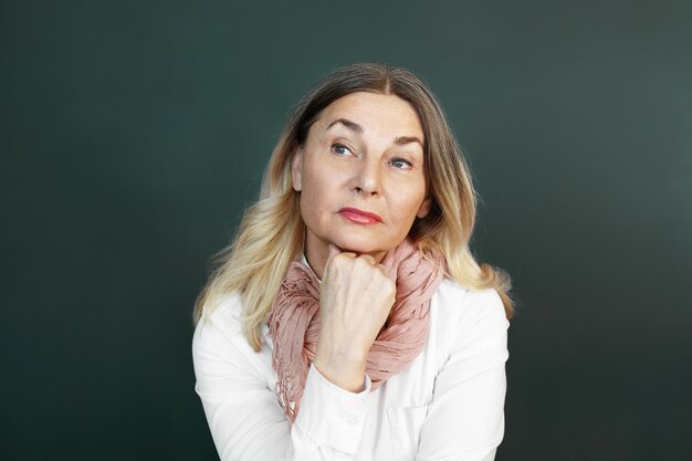 Expressive middle aged woman posing