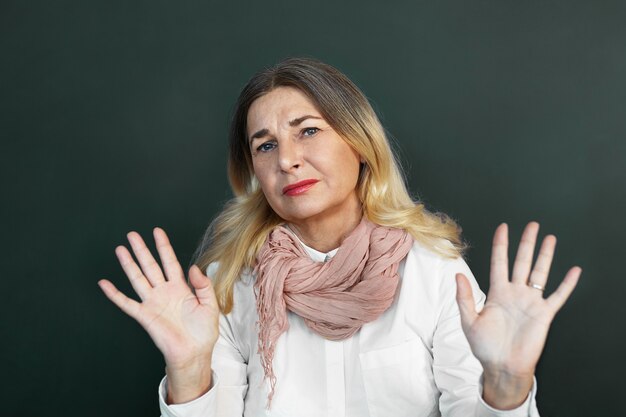 Expressive middle aged woman posing