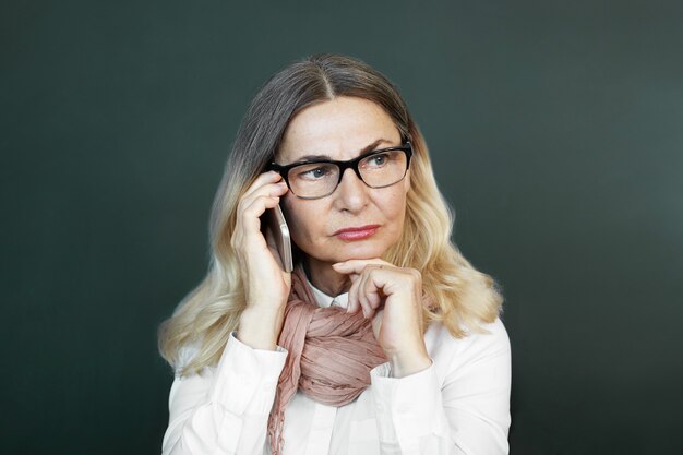 Expressive middle aged woman posing