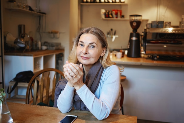 Expressive middle aged woman posing