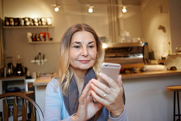 Expressive middle aged woman posing