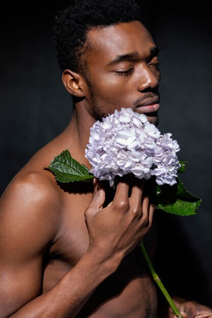 Expressive model posing with flower close-up