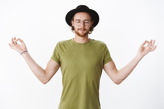 Expressive redhead bearded man with a hat