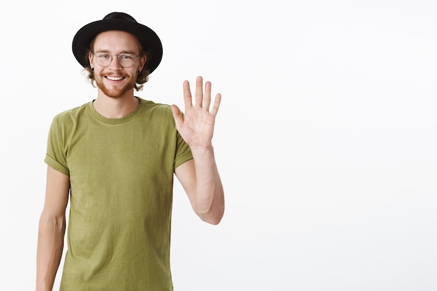 Expressive redhead bearded man with a hat